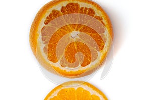 The orange fruit is isolated on a white background with orange slices