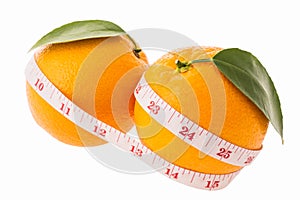 Orange fruit and measuring tape