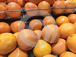 Orange fruit on rack for sale in the supermarkets.