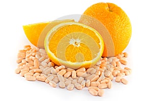 Orange fruit with vitamin c tablet