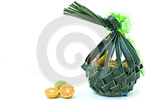 Orange fruit in wickerwork basket