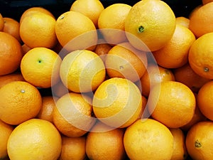 Orange is a fruit that is widely available in the market.