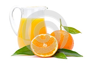 Orange fruits and jug of juice