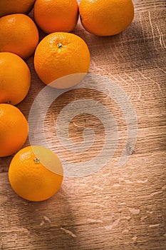 Orange fruits with organized copyspace on wooden