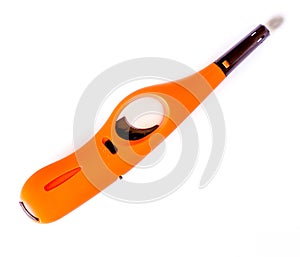 Orange gas lighter gun on white