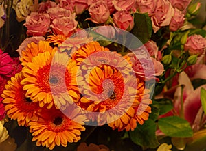 Orange gerber flower bouquet and roses