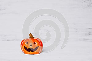 Orange ghost pumpkins on grunge rusty white wooden borad background with copy space for your text. halloween background minimal