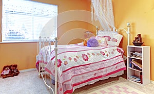 Orange girl teenager kids bedroom with toys, white bed frame and
