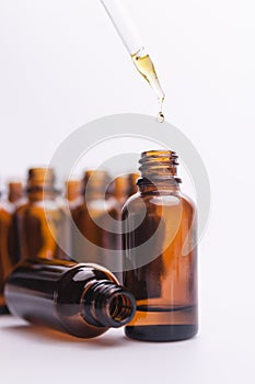 Essential Oil Glass Bottle With Dropper and Bottles in Background II