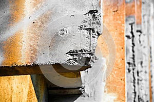 Orange and gray damaged reinforced concrete structure