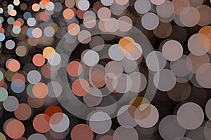 Orange gray pattern of round shapes on a black background.