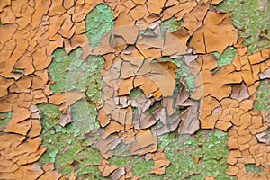 Orange and green peeling paint background