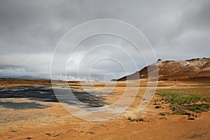 Orange ground and hot steam at Hverarond area, Iceland