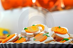 Orange Halloween cookies shaped like pumpkins