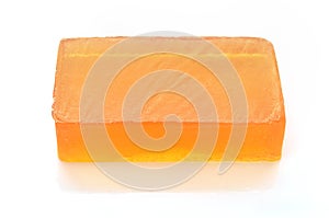 Orange handmade glycerin soap on white. photo