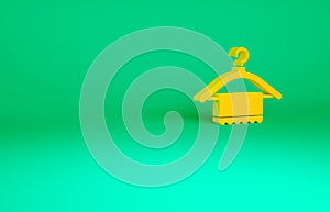 Orange Hanger wardrobe icon isolated on green background. Clean towel sign. Cloakroom icon. Clothes service symbol