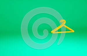 Orange Hanger wardrobe icon isolated on green background. Cloakroom icon. Clothes service symbol. Laundry hanger sign