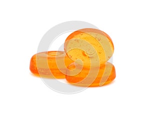 Orange hard candy isolated on white