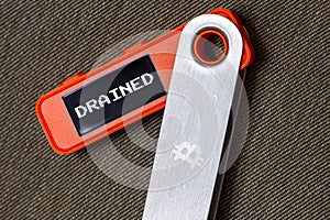 hardware Bitcoin wallet with message drained on screen