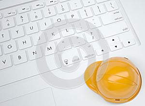 Orange helmet on the keyboard