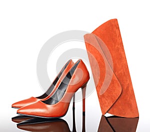 Orange high heels pointed woman shoes and hand bag