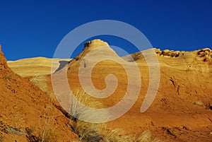 Orange hills and blue sky