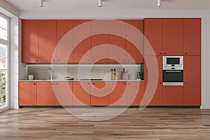 Orange home kitchen interior with cooking area and kitchenware, window