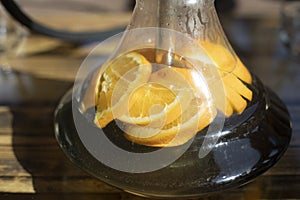 Orange in hookah. Smoking through orange. Glass hookah