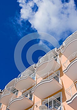 Orange Hotel in front of a blue sky