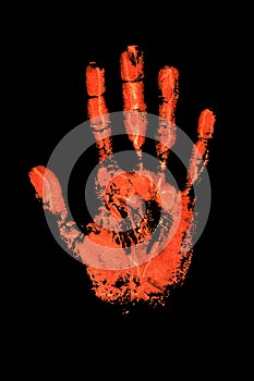 Orange human hand print on black background isolated close up, red handprint illustration, palm and fingers silhouette mark