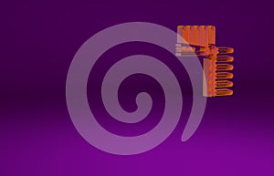 Orange Indian headdress with feathers icon isolated on purple background. Native american traditional headdress