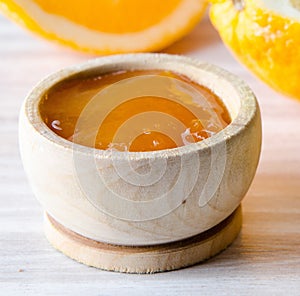 Orange jam served in spoon on the table