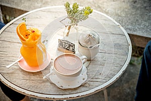 Orange juice blended into a glass jar or Orange smoothie Decorated with orange