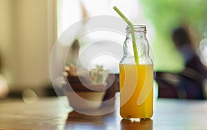 Orange Juice bottle with straw
