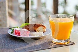 Orange juice and a Breakfast plate