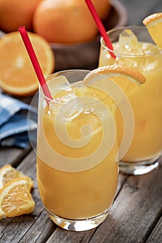 Orange juice cocktail in glasses with orange slices