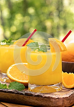 Orange juice cocktail with mint and orange slices