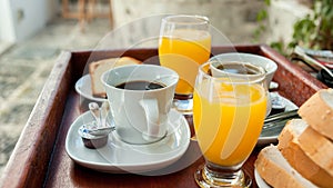 Orange juice and coffee as a part of a continental breakfast photo