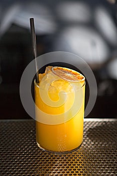 Orange juice drink on a bar photo