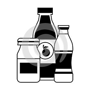 Orange juice drinks and yogurth bottles in black and white photo