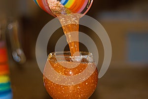 Orange juice in glass, blur background