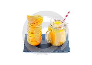 Orange juice in glass on isolated white background photo