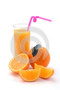 Orange juice in a glass and an orange