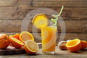 Orange juice in glass rustic background