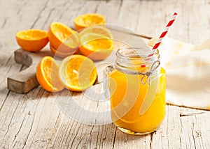 Orange juice on glass on wooden table rustic photo