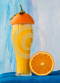 Orange juice and half of an orange