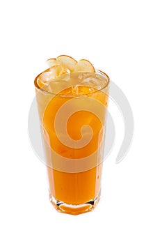 Orange juice with ice in a glass on an isolated white background