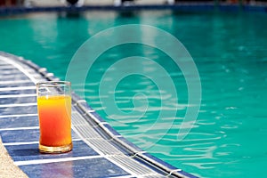 Orange Juice Near Water Pool