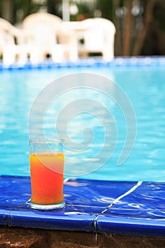 Orange Juice Near Water Pool