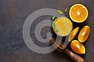 Orange juice, oranges and and juicer